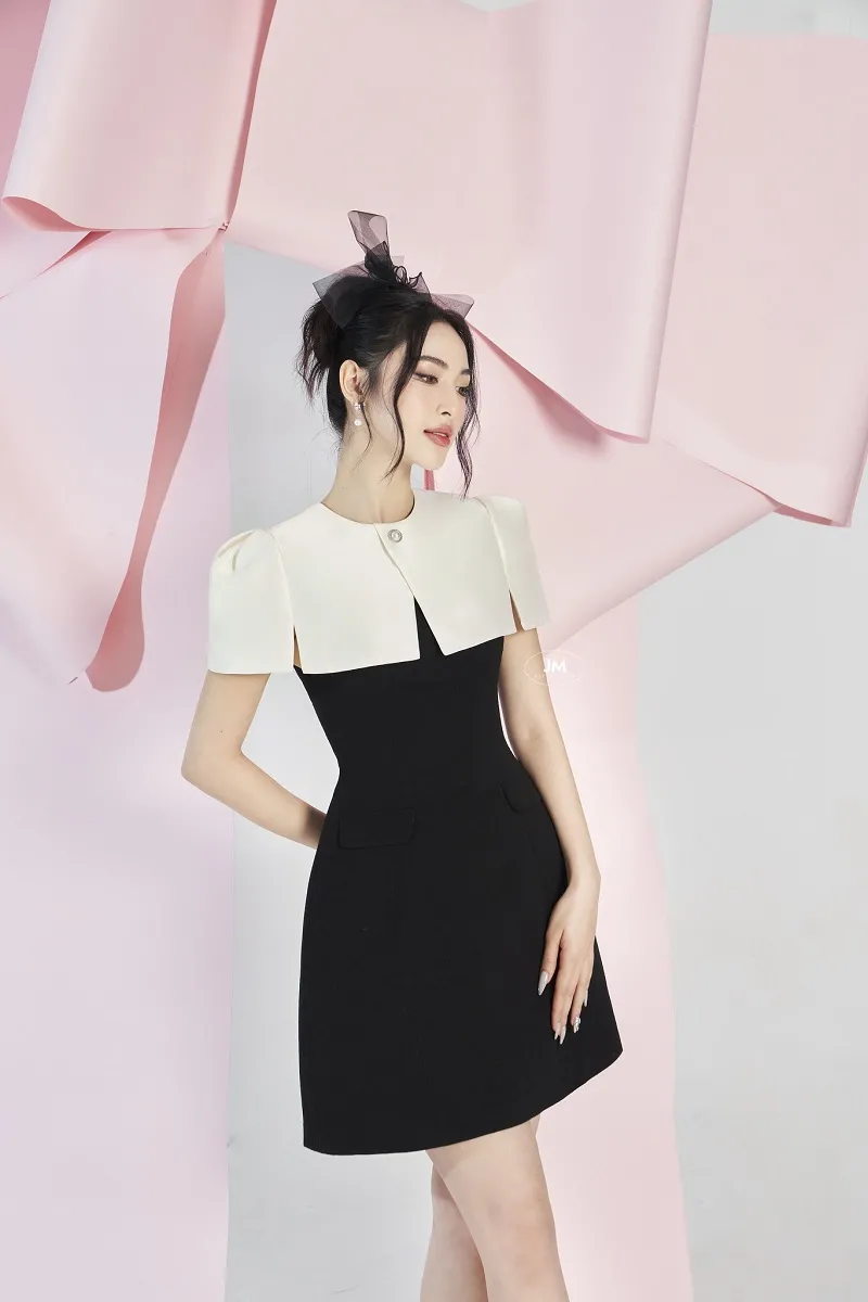 Tạo dáng váy xòe nhìn hướng khác tạo vẻ bí ẩn